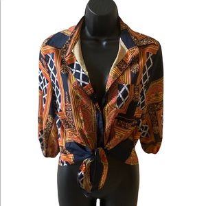 Boutique top orange and black print